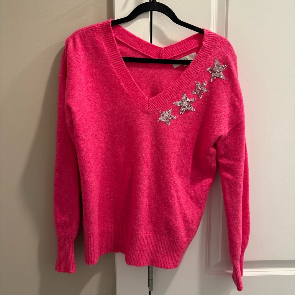 Pink sweater with silver star embellishments